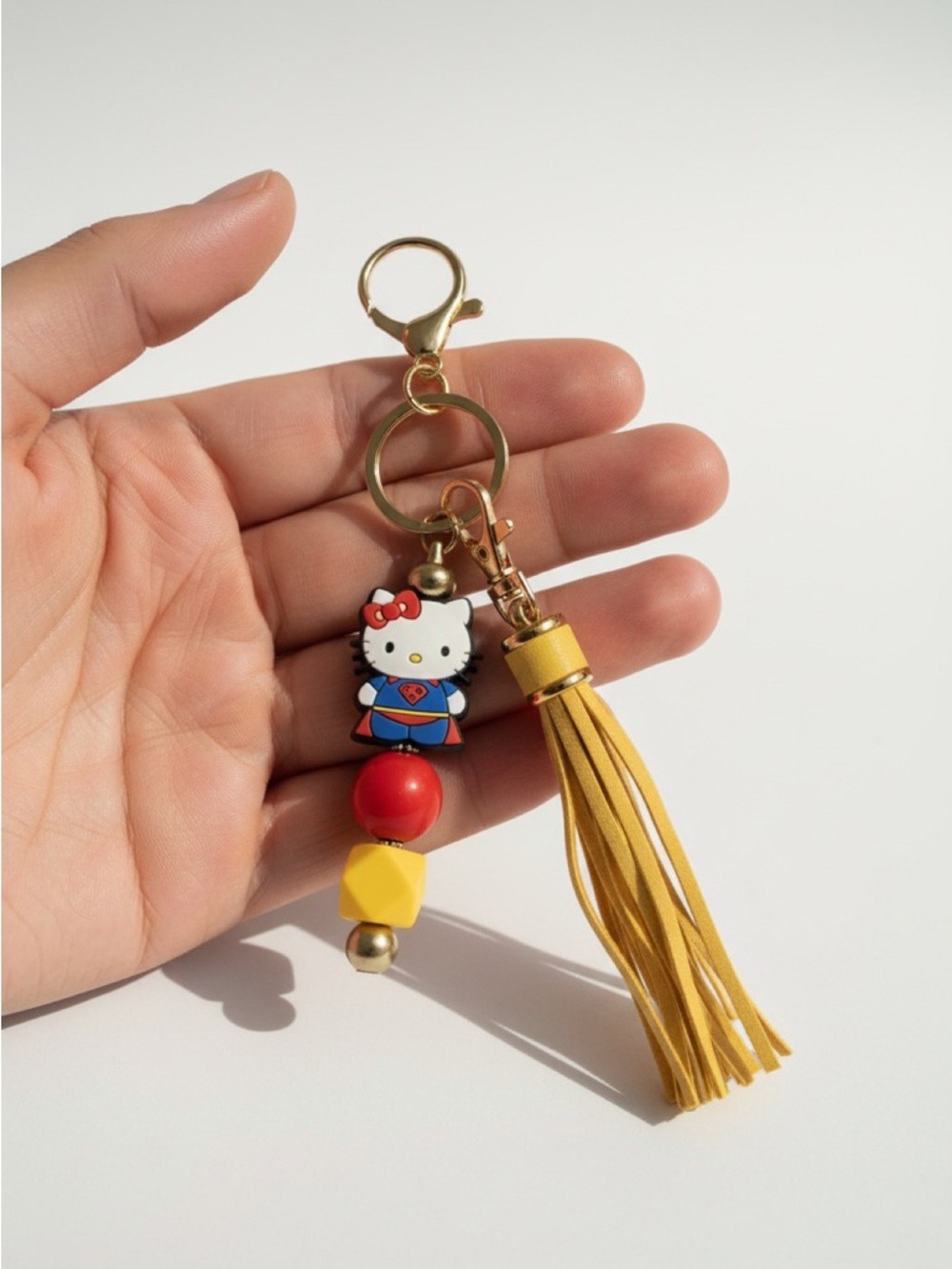 Hello Kitty Supergirl Keychain with Red & Yellow Accents